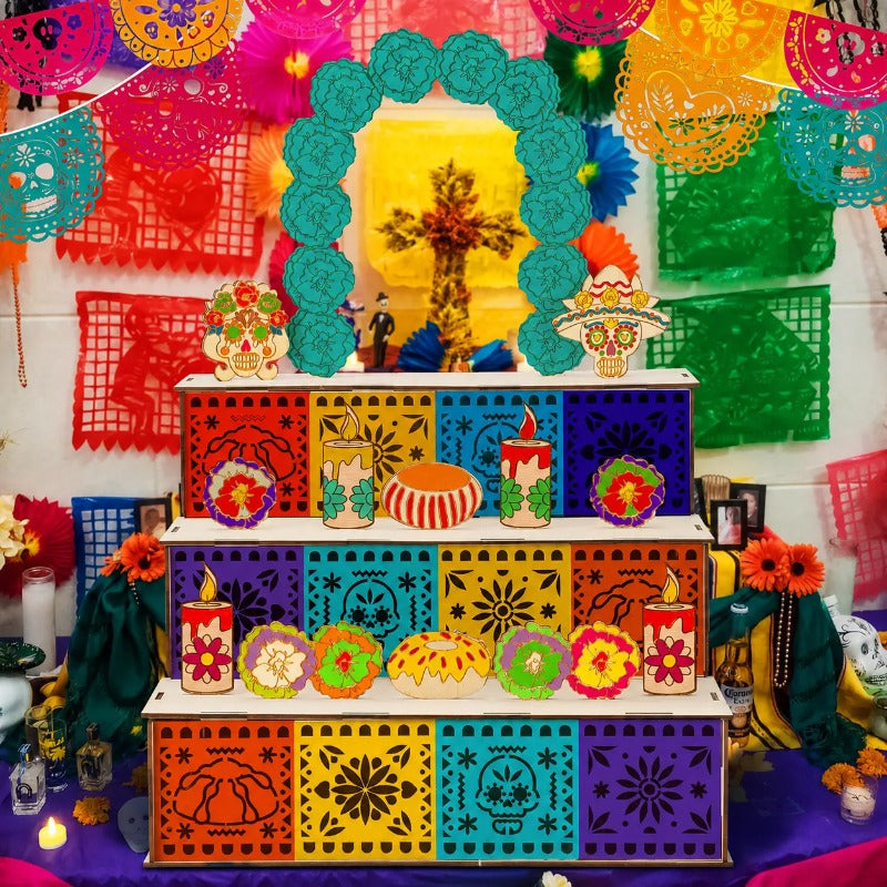 Three-tier wooden Day of the Dead altar display with marigold arch