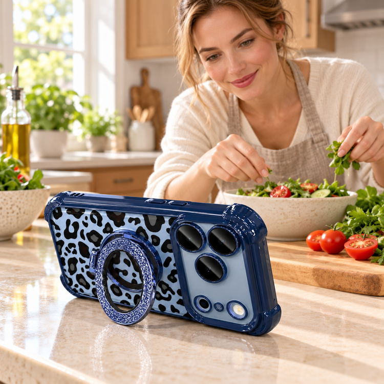 Blue leopard phone case propped on its open ring stand while a woman prepares a salad in a home kitchen