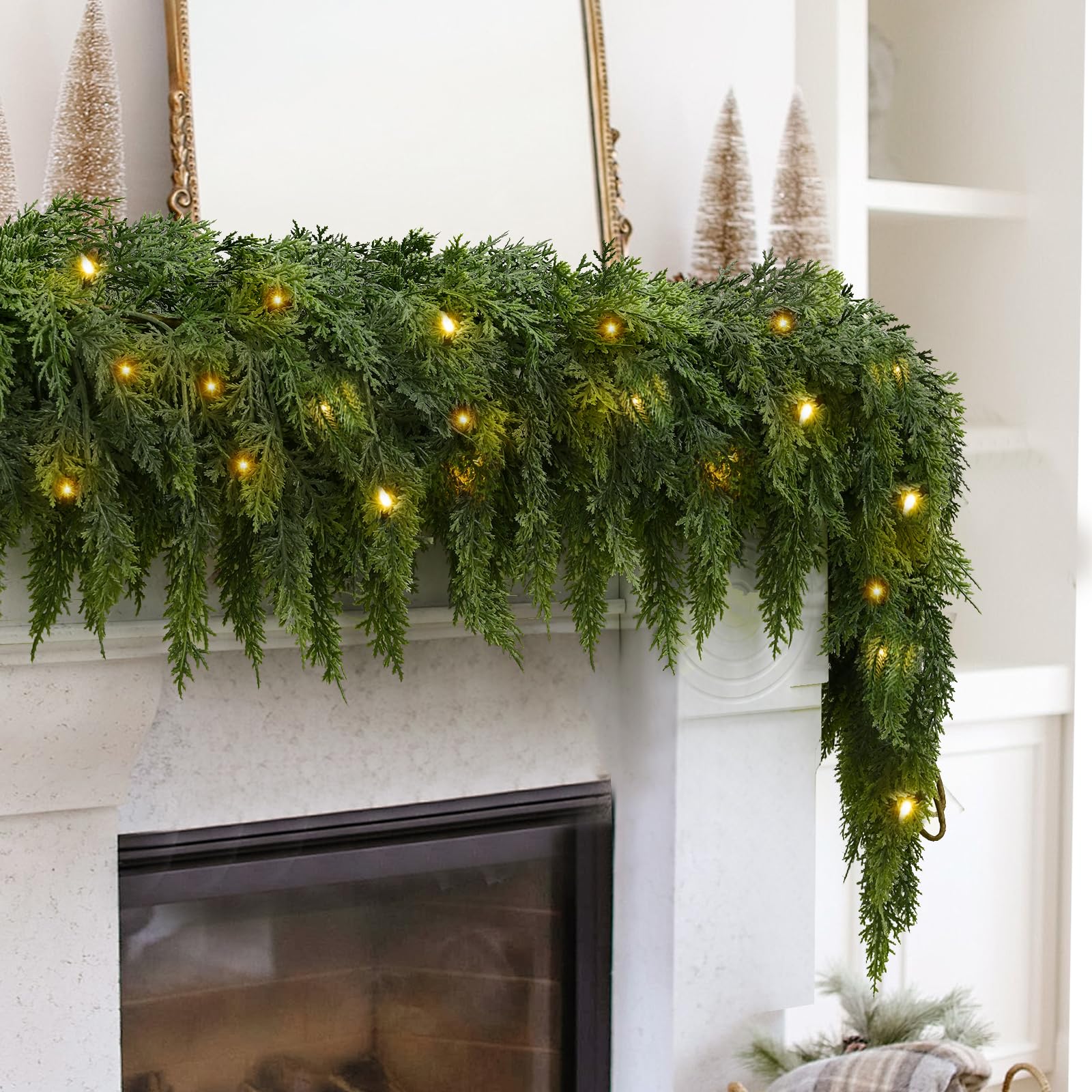 Warm pre-lit cedar garland on Christmas fireplace