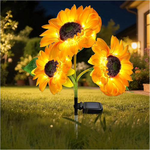 Solar sunflower garden light with three illuminated flower heads