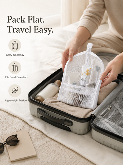 Compact toiletry pouch packing flat inside a carry-on suitcase