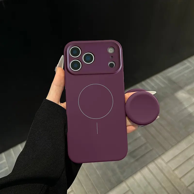 Cherry purple silicone phone case and matching magnetic stand held in hand