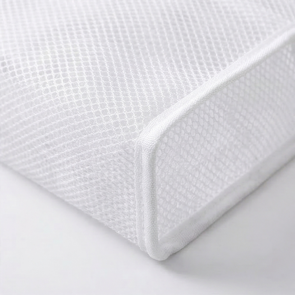 Close-up of reinforced flat base on toiletry pouch