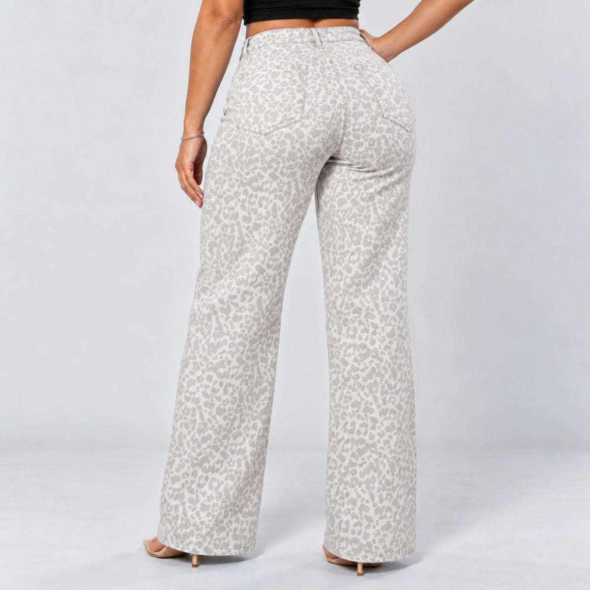 White Leopard | Back three-quarter, hand on hip