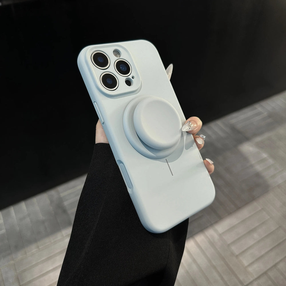 Cloud cyan phone case with matching circular stand shown in hand