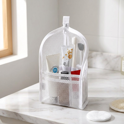 White upright toiletry pouch filled with daily essentials